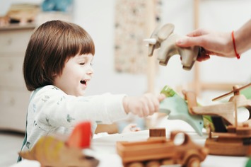 Engaged kid laughing